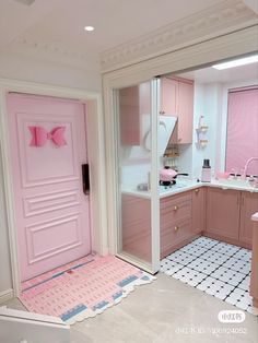 a bathroom with pink walls and white floors