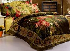 a bed room with a neatly made bed and flowers on the comforter, along with two nightstands