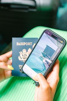 a person holding a passport and cell phone