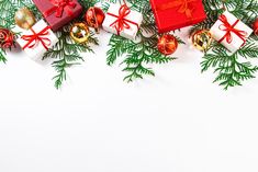 christmas decorations and presents on white background with copy - space for text or image, top view