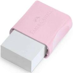 a pink and white eraser sitting on top of a white table next to a box