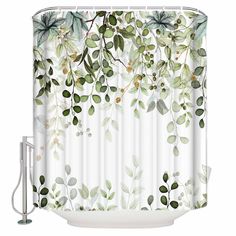 a shower curtain with green leaves and branches on the outside, in front of a white background