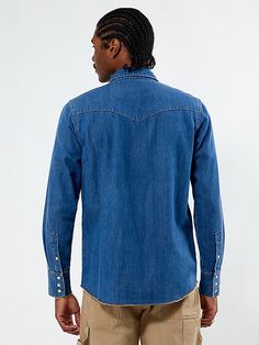 The Wrangler x PacSun Western Denim Long Sleeve Shirt combines rugged style with classic detailing. Featuring a dark indigo wash, a classic single button collar, western stitch details throughout, snap-flap chest pockets, a snap front closure, and a slightly frayed hem, it’s finished with a Wrangler x PacSun woven label at the flap pocket for an authentic touch. Denim Long Sleeve Shirt, Pacsun Mens, Denim Shirt Men, Long Sleeve Denim Shirt, Wrangler Shirts, Rugged Style, Dark Indigo, Woven Label, Men's Shirts