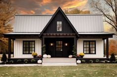 a black and white house with two front porches