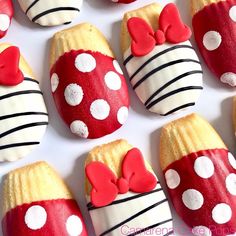 red and white decorated cookies with bows on them