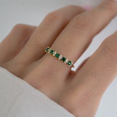 Beautifully crafted emerald ring is a true stunner! Looks great stacked or on its own! - - - D E T A I L S - - - * Made of 925 Sterling Silver * We use a THICK plating of 14k Gold or Rhodium * Available in sizes 4-10 * Nickel-free & Hypoallergenic - Will not turn your fingers green! * Made of the highest grade cubic zirconia for an authentic look! * Also available in Turquoise or Opal! If you're unsure of your ring size, we recommend trying our ring size tool! https://www.etsy.com/listing/124090 Emerald And Silver Ring, Classic Green Diamond Stackable Ring, Elegant Green Stackable Diamond Ring, Classic Green Emerald Cut Stackable Rings, Classic Green Emerald-cut Stackable Rings, Classic Green Stackable Diamond Ring, Green Emerald Stackable Rings With Prong Setting, Green Half Eternity Stackable Rings Fine Jewelry, Green Emerald Cut Rings With Half Eternity