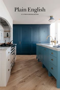 an image of a kitchen with blue cabinets and wood flooring on the phone screen