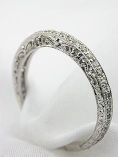 an image of a wedding ring with diamonds on it