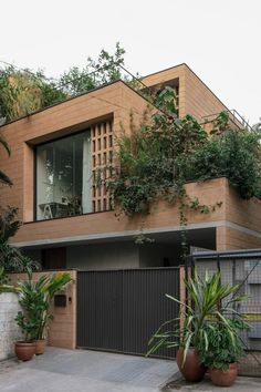 the house is surrounded by trees and plants