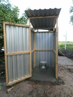 an outdoor toilet is built into the ground