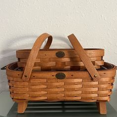 a wooden basket sitting on top of a table