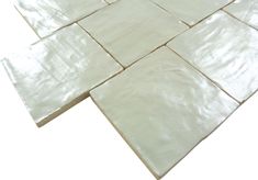 a white tile floor that has been laid out on top of each other with no tiles