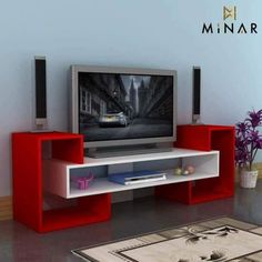 an entertainment center with a flat screen tv on it's stand and red shelves