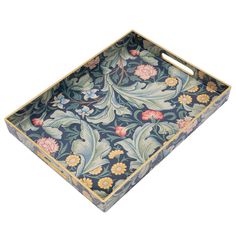 an ornately decorated tray with flowers and leaves in blue, pink, yellow and green