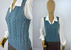 a mannequin wearing a blue cable knit sweater vest