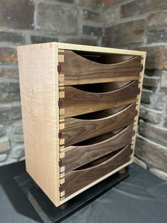 a wooden drawer sitting on top of a table