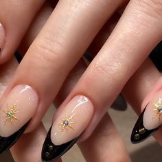 Christie Rhae Gibson on Instagram: "Classic black French with gold chrome ❤️ #nails #chiconails #nailart #chicostate #blackfrenchnails #almond #goldchrome #starburst" French Nails With Gold Stars, Black And Gold Nails Stars, Black French Tip Nails With Jewels, Short Black And Gold Nails Ideas, Black French With Gold, Black Tip Nails With Design, Black And Gold Nails Design Classy, Black And Gold Nails Almond, French Tip With Nail Art