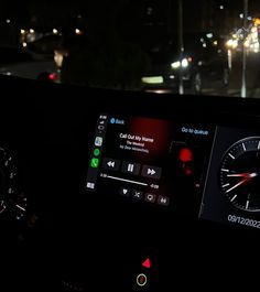 the dashboard of a car at night time