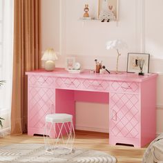 a pink desk and chair in a room