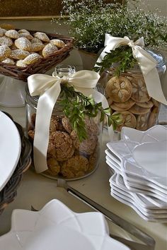 a table topped with plates and bowls filled with food