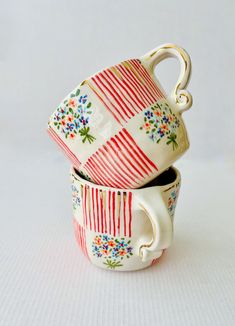 two cups are stacked on top of each other