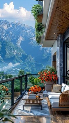 a balcony with furniture and flowers on the table in front of it, overlooking mountains