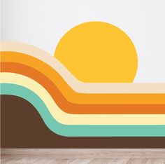 the sun is setting over an abstract landscape wall decal in a room with hardwood floors