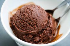 a white bowl filled with chocolate ice cream