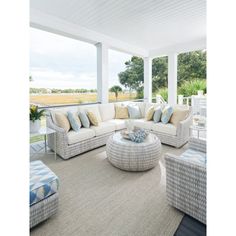 a living room filled with furniture and lots of windows on top of a white roof