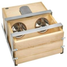 a wooden box with two metal bowls in it's lid and one drawer open