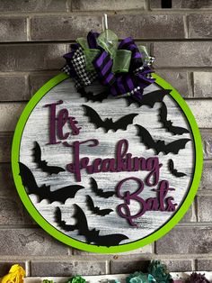 a wooden sign that says it's freaking to be bats hanging on the wall