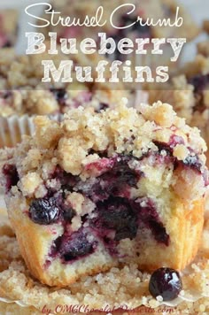 blueberry muffins stacked on top of each other with crumbs in the middle