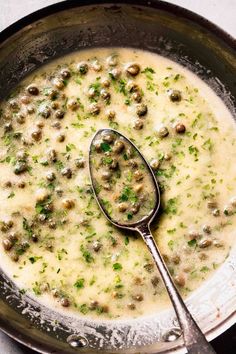 a bowl filled with soup and a spoon