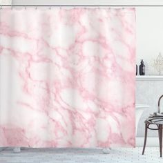 a bathroom with a pink marble shower curtain