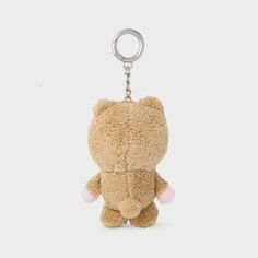 a brown teddy bear keychain on a white background