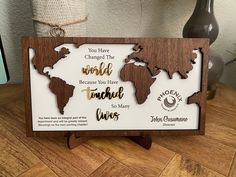 a wooden plaque with the words you have changed the world