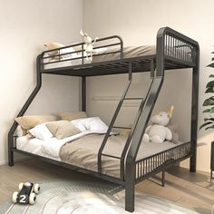 a bunk bed with two sets of stairs on the bottom, and a stuffed animal next to it