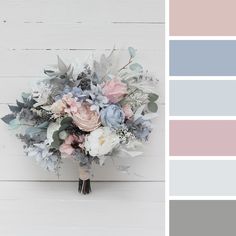 a bouquet of flowers on top of a white table next to a color swatch