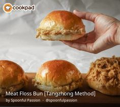 a person holding a sandwich in front of three buns on a cutting board with the words meat floss bun tangong method