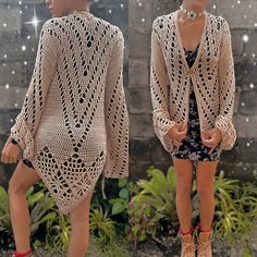 a woman wearing a crocheted cardigan and boots