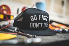 Blockhead Foamie Mother Trucker Hat Black – Go Fast Don't Die Customizable Black Trucker Hat In One Size, Customizable Black Trucker Hat, Black Trucker Hat With Graphic Print, Functional Black Six-panel Trucker Hat, Black 5-panel Trucker Hat, Crown Heights, Everyday Carry, Trucker Hat, Hats