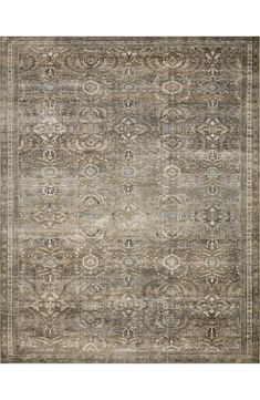 an antique rug with many different colors and patterns on the carpet, including greys