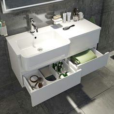 a white sink sitting under a mirror in a bathroom