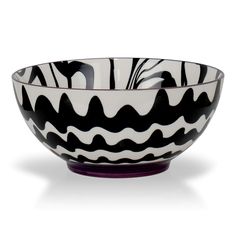 a black and white bowl sitting on top of a table