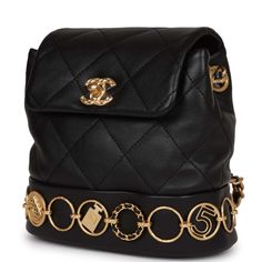 This Small Charm Backpack is of Black Calfskin with aged gold hardware, features metal details depicting Chanel icons and symbols, classic CC turnlock closure, an exterior back pocket, and aged gold tone interwoven chainlink shoulder straps.The interior is lined in black fabric and features a singular leather pocket on the back wall. Collection: 23BOrigin: ItalyCondition: New and never worn Accompanied by: Chanel box, Chanel dustbag, detachable shoulder strap, retail UPC and ribbonMeasurements: 2024 Handbags, Everyday Handbags, Classy Handbags, Office Handbags, Trending Handbags, Chanel Box, Leather Pocket, Travel Handbags, Stylish Handbags