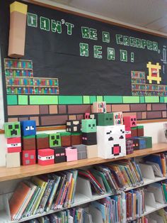 a bunch of books that are sitting on a shelf in a room with a chalkboard