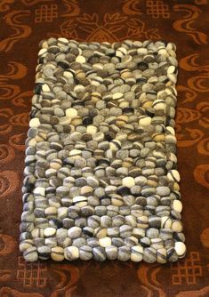 a rug with rocks on it laying on the floor