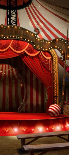 a red and white circus tent with lights