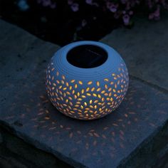 a blue vase sitting on top of a stone slab