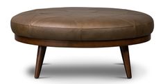 a brown leather ottoman sitting on top of a wooden frame footstool in front of a white background